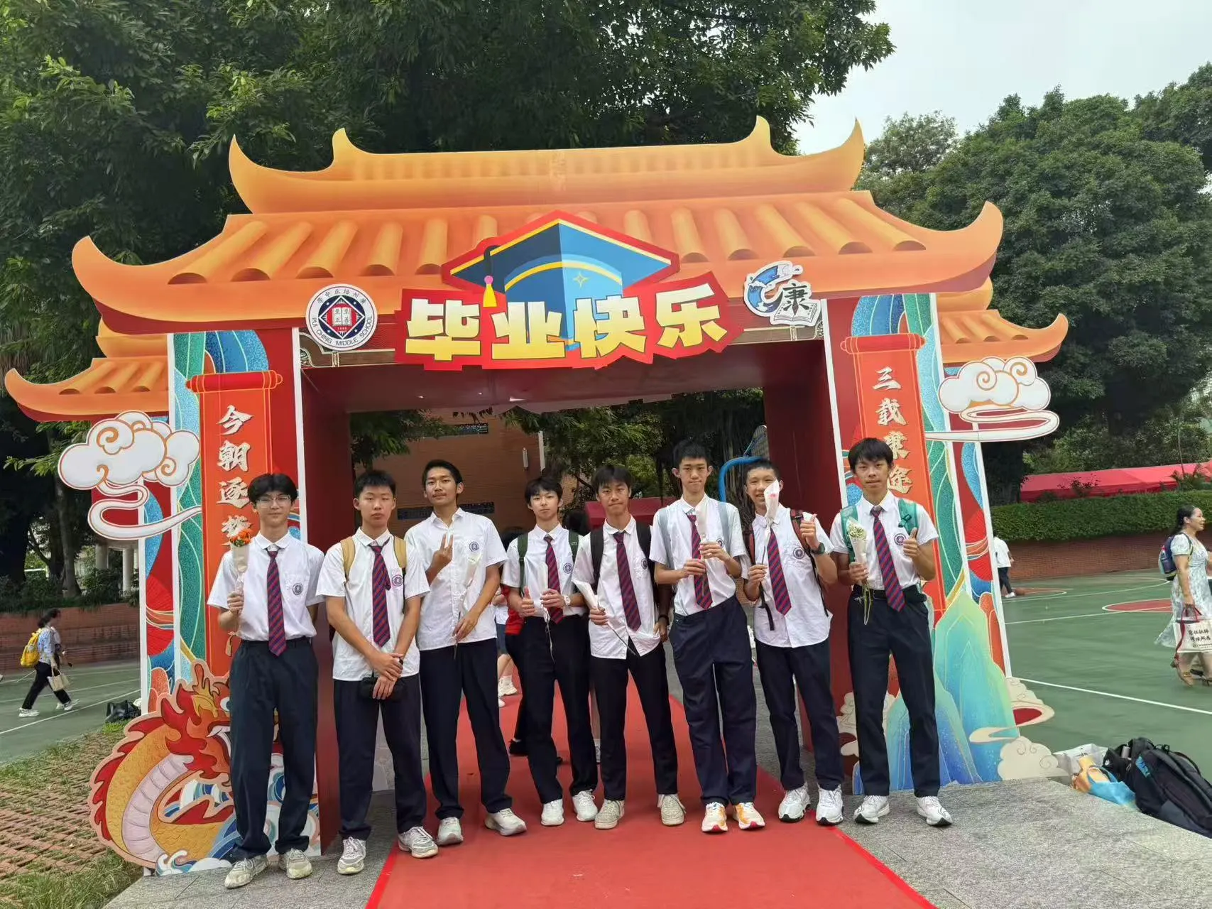 Noah with school friends at a graduation celebration